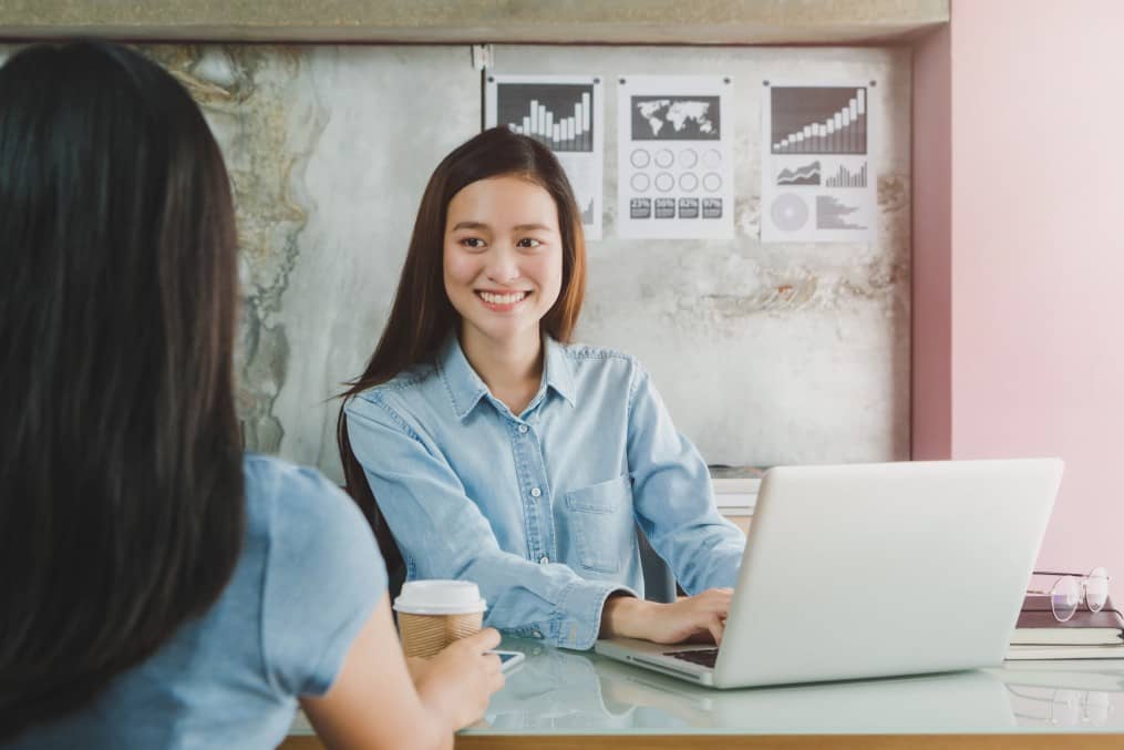 A female workers inside a coworking space - SE Asia, Singapore.