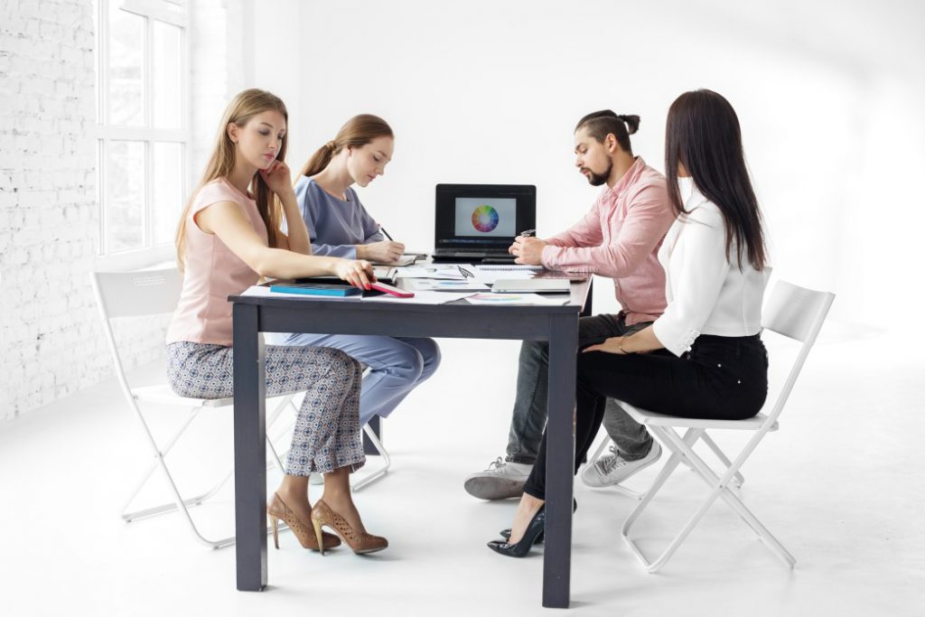 Group of people inside a coworking environment.