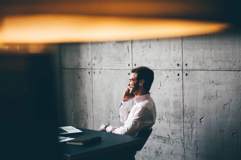 A man on a phone focused on productivity.