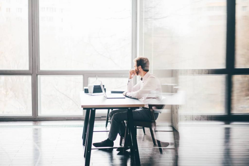 A man thinking while working in an office. 