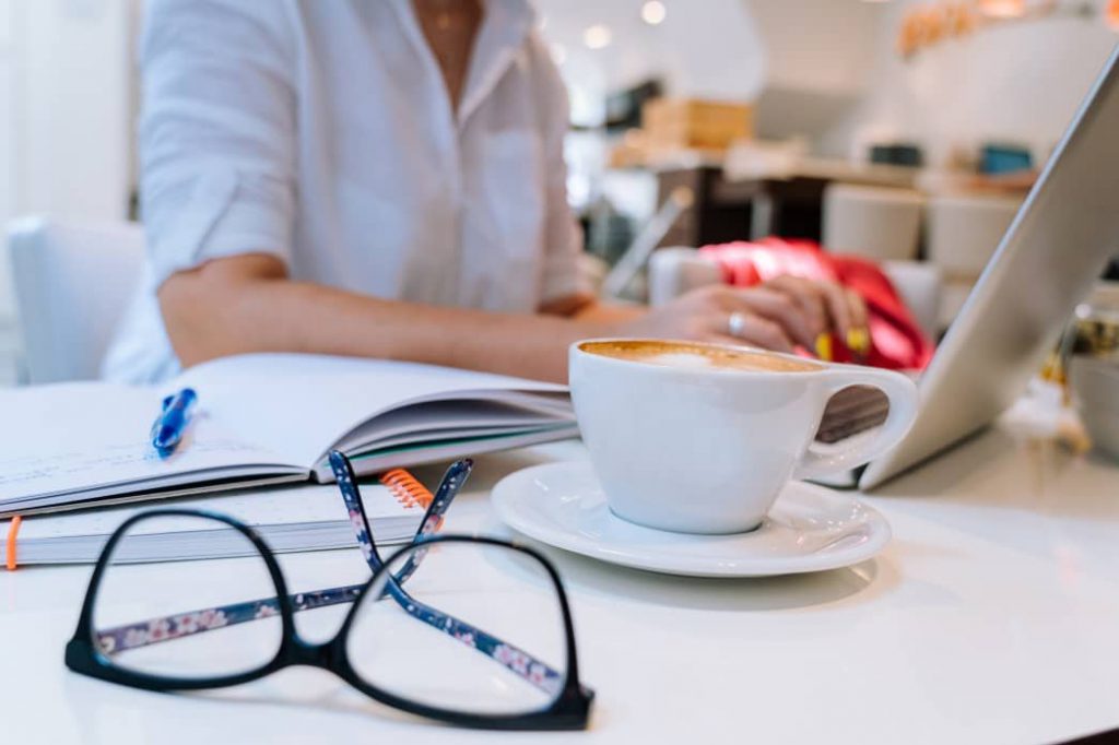 Lady working at a coworking cafe.