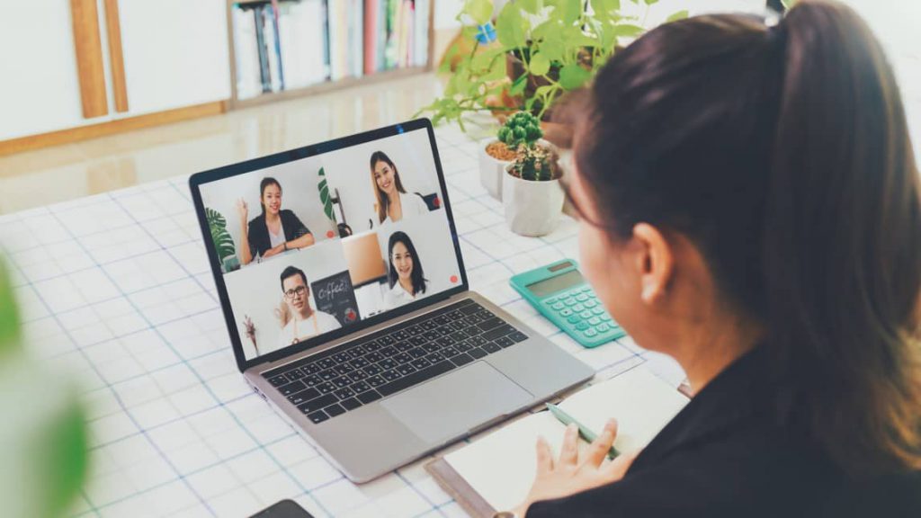 Team meeting in a private office over web conferencing but in a quiet room.