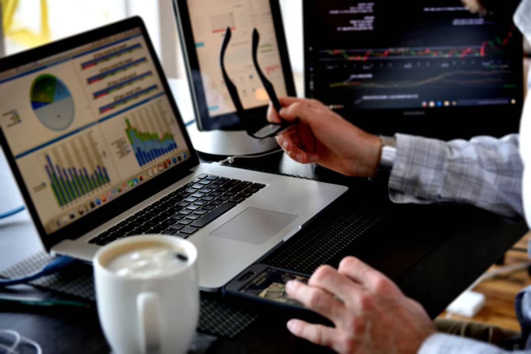 Analyzing data at the desk with coffee business, working, technology, coffee, glasses, desk, computers, data, startup, analysis, multiple devices