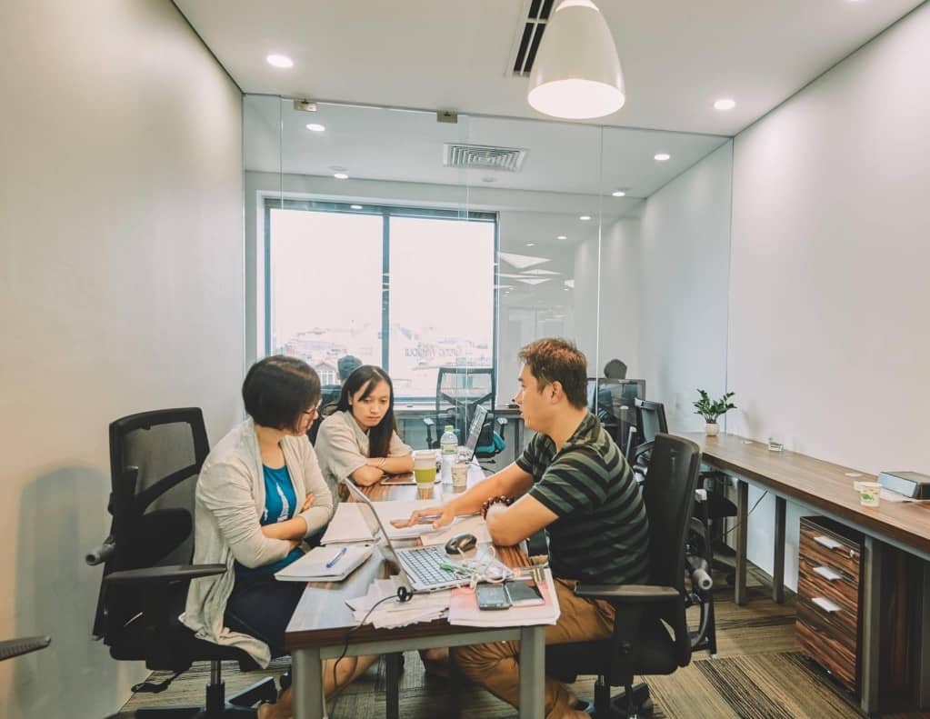 group of people, office, teamwork, small business, discussion, collaboration, startup, using laptop, business professional, business meeting, modern office, modern company, company culture