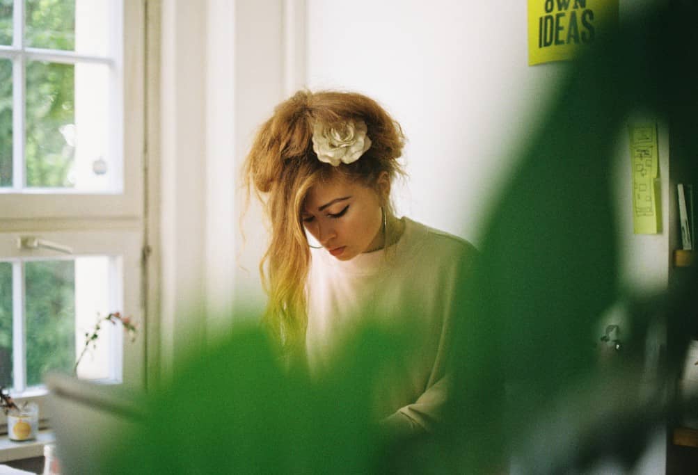 Beautiful young woman working from a coworking location