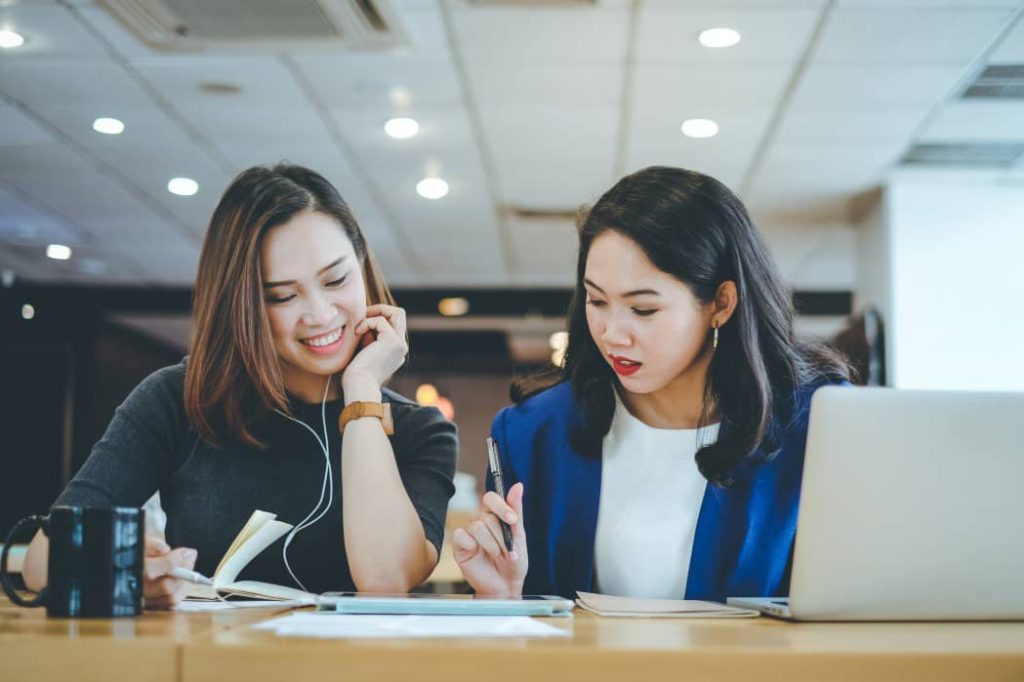 Two asian businesswomen meeting and discussing about working process at the office, business concept two people, business, working, office, businesswoman, asian, laptop, meeting, workspace, discuss
