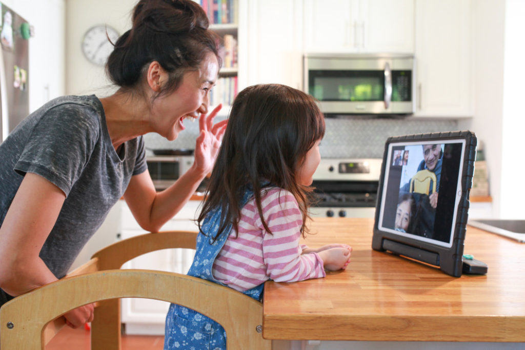 mother and daughter video chats a relative to celebrate the chinese new year in 2021