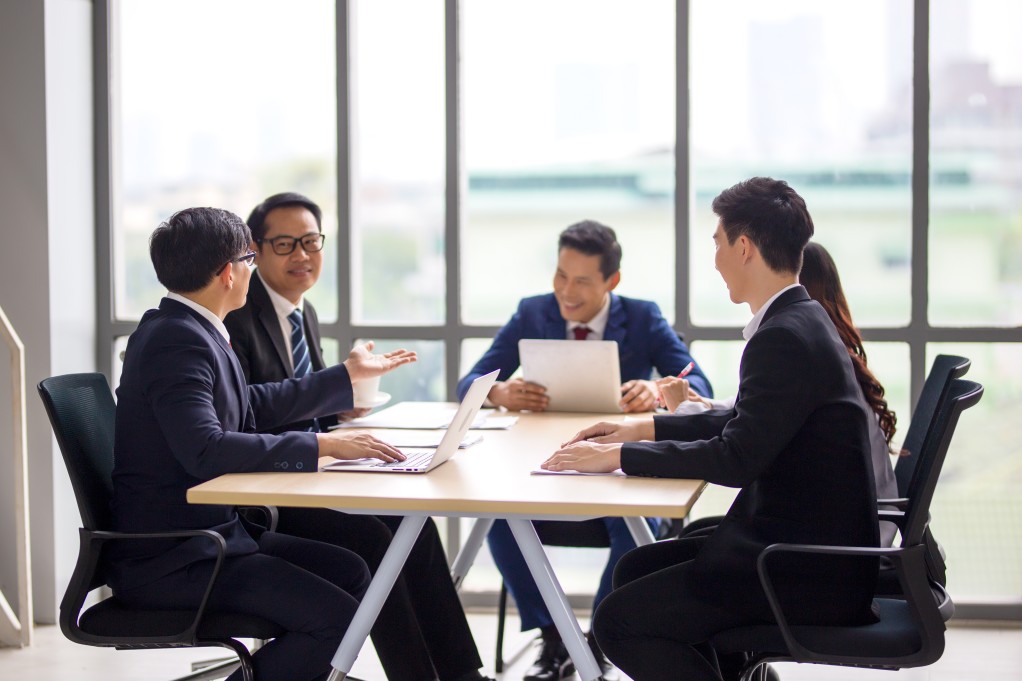 experienced coo running a business meeting in singapore